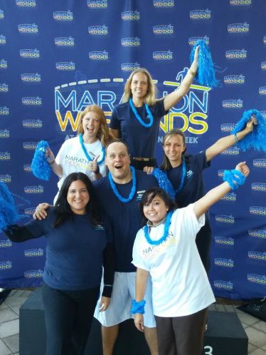 A very fun enthusiastic staff cheering for all the runners!